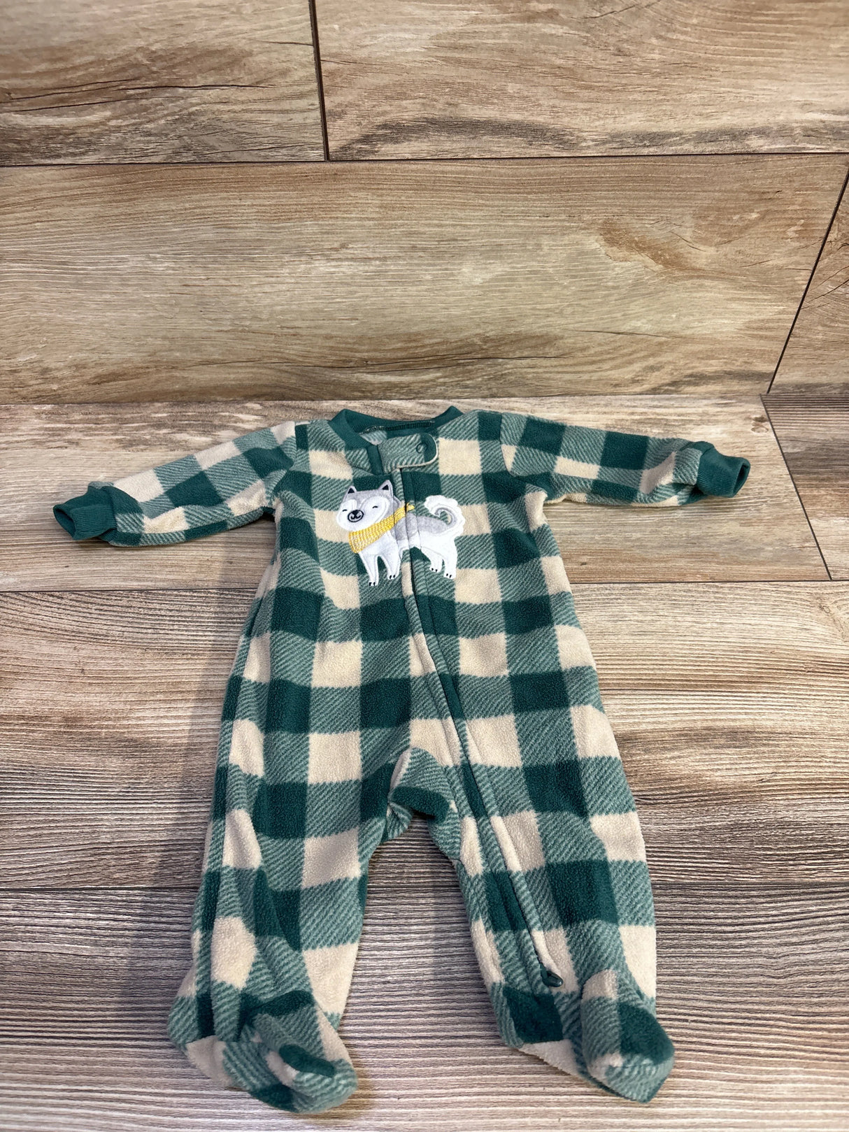 Front flat-lay of Carter’s newborn blanket sleeper, green and cream buffalo check, front zipper, footed legs, embroidered dog