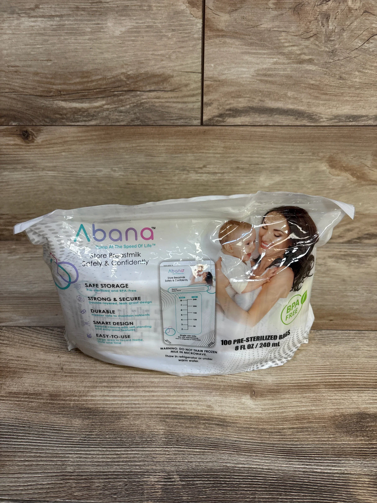 Pack of Abana pre-sterilized breast milk storage bags on wood background