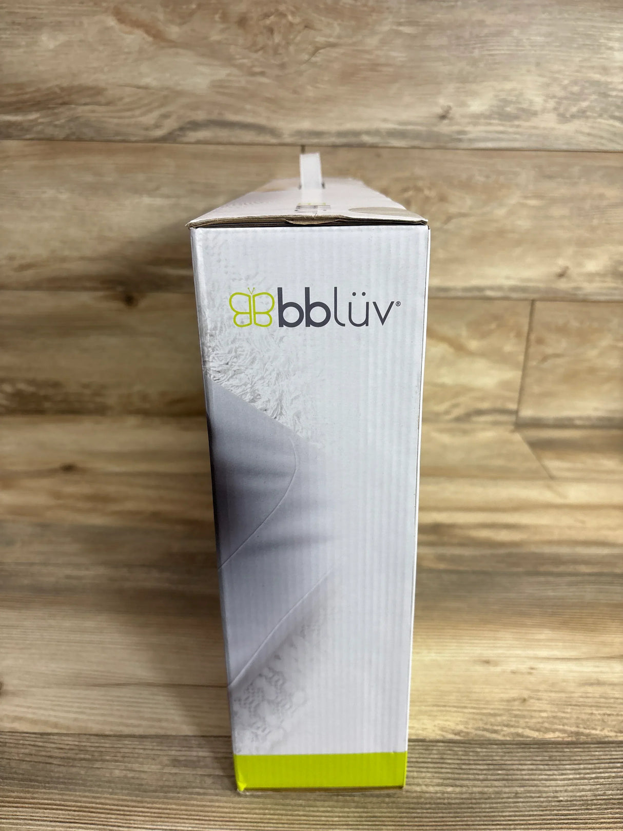 Front view of bbluv Ergo complete set box showing bbluv logo and packaging design on wooden surface