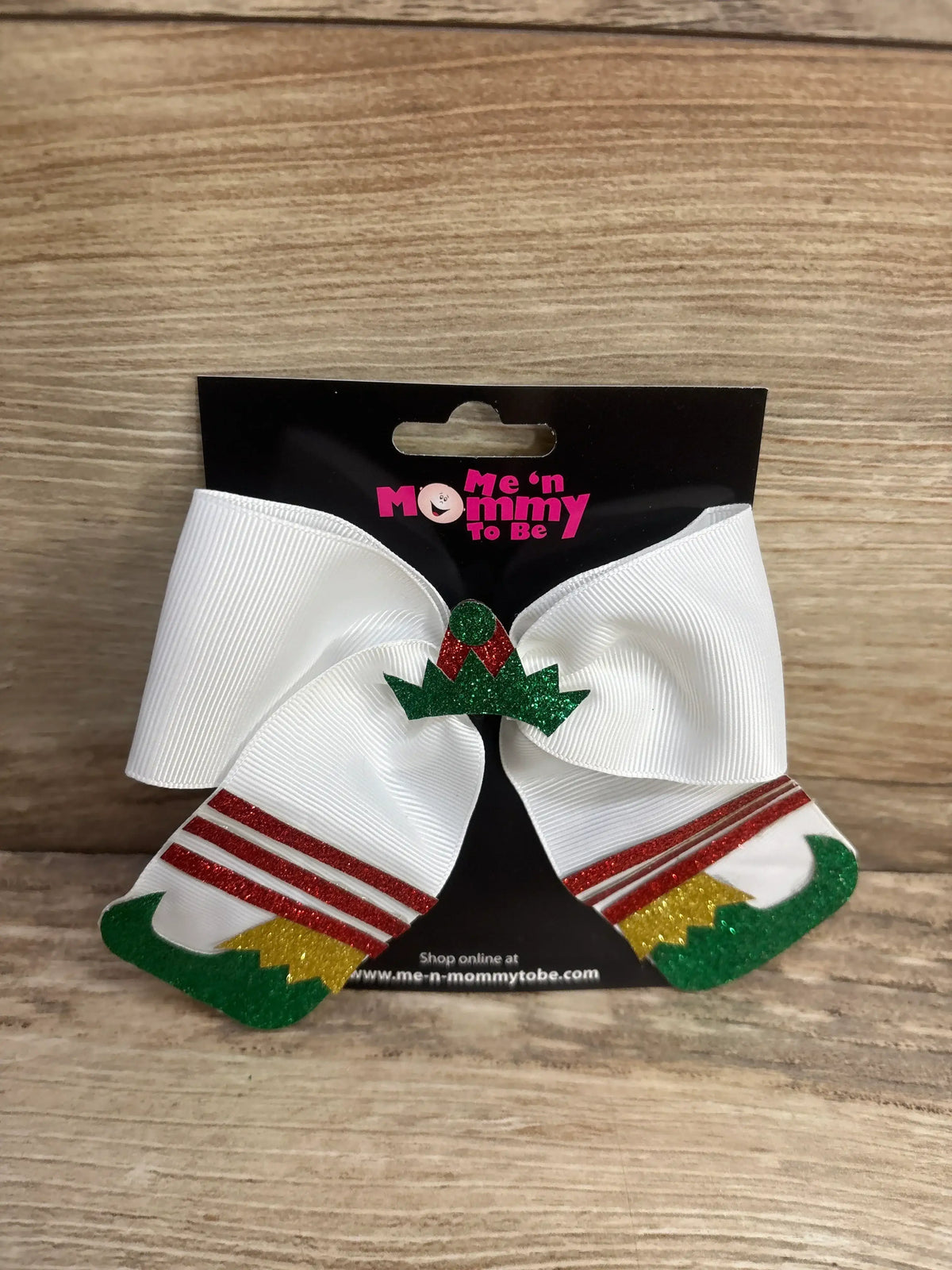 White Christmas elf hair bow with green glitter hat and red striped legs, perfect for kids holiday outfits.