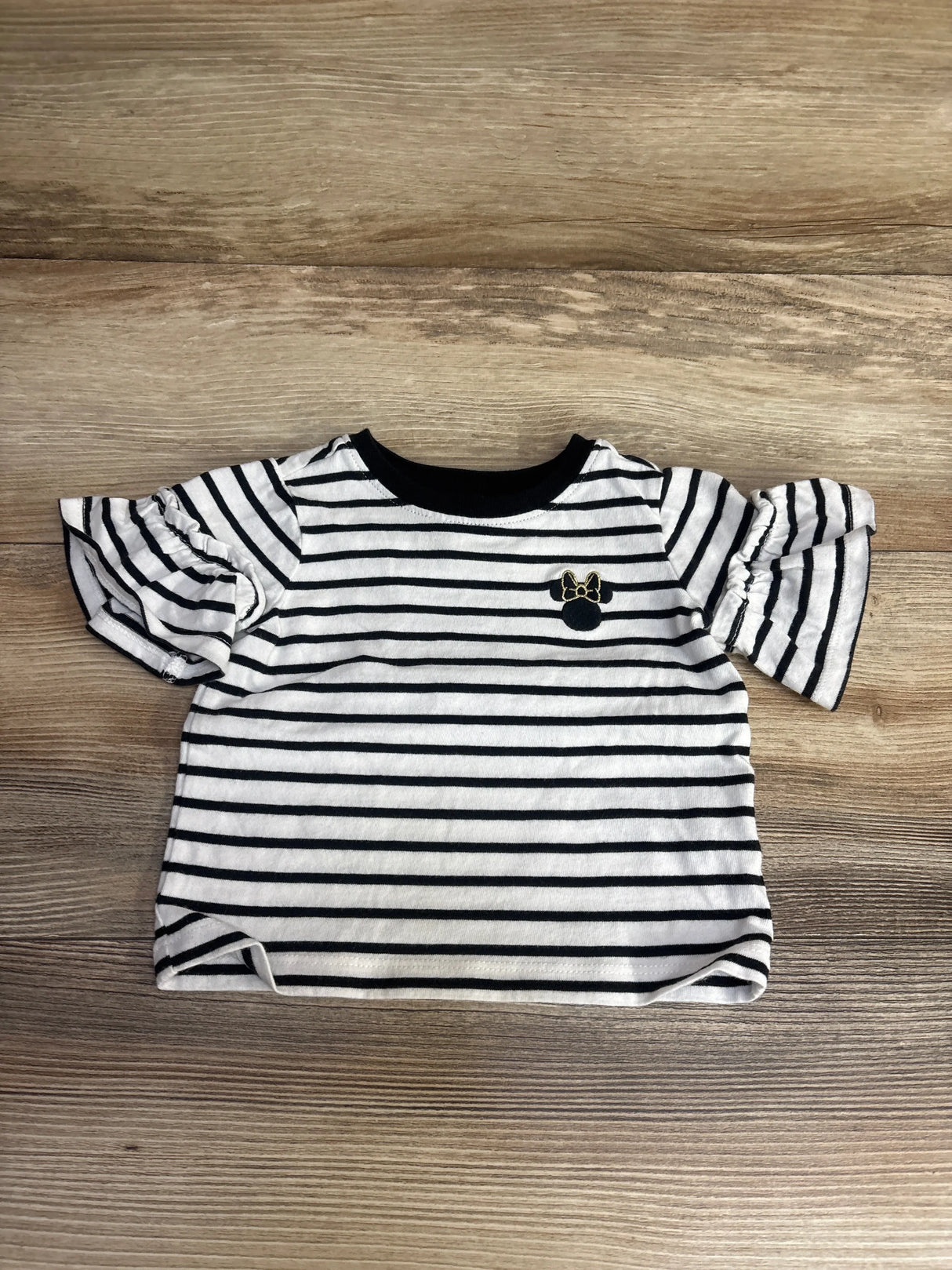 Black and white striped toddler girl's shirt with ruffle sleeves and Minnie Mouse emblem