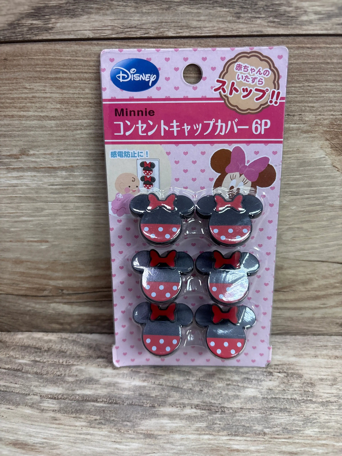 6-pack of Disney Minnie Mouse themed outlet plug safety covers in pink packaging