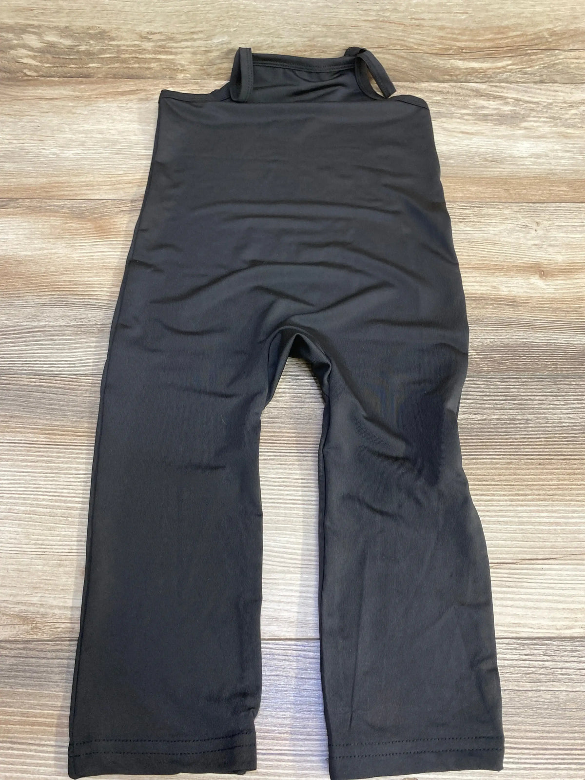 Front view of black Shein baby jumpsuit, 18–24 months, short sleeves and snap crotch on white background