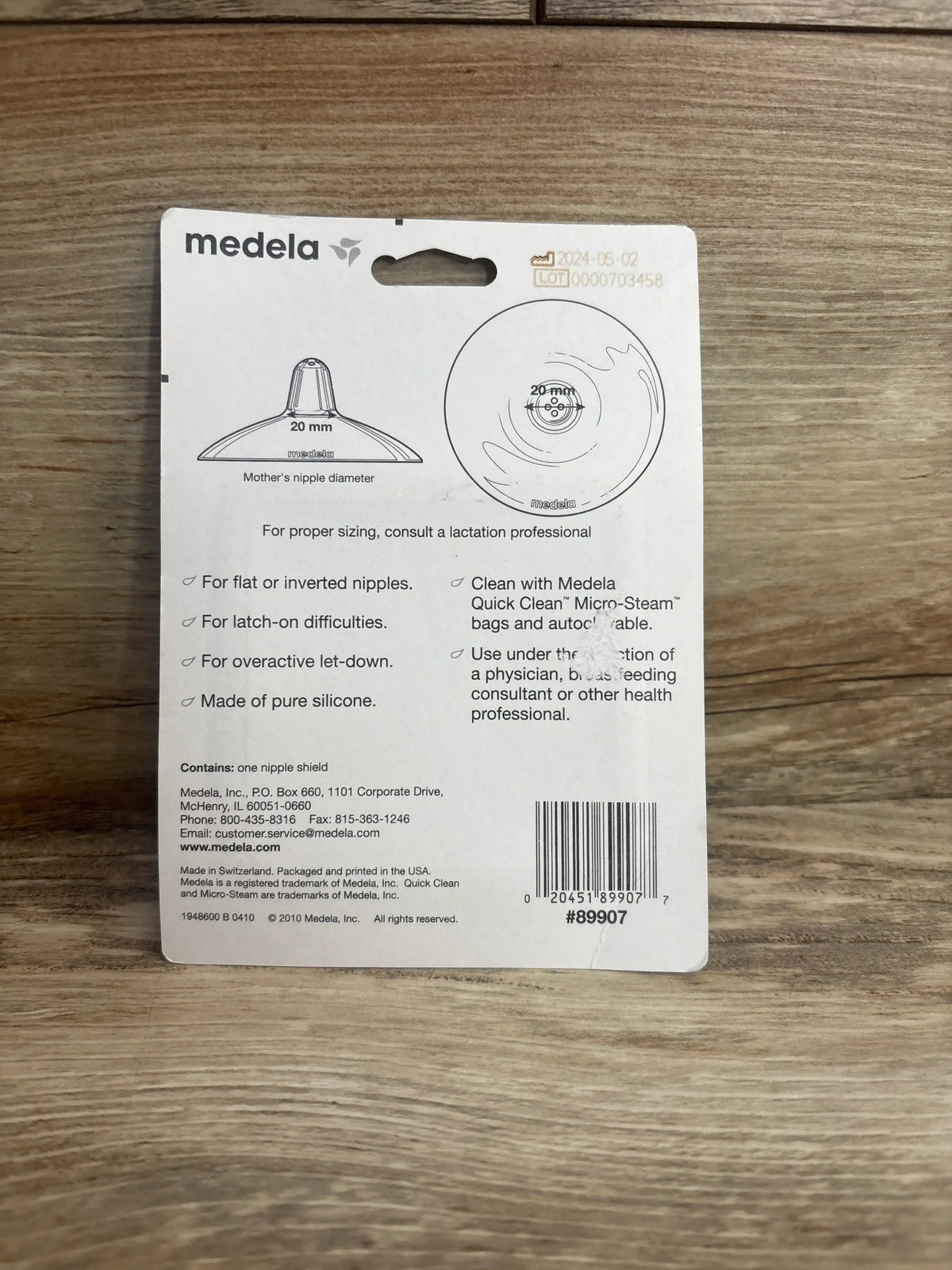 Medela 20mm silicone nipple shield packaging for breastfeeding support, product details visible.