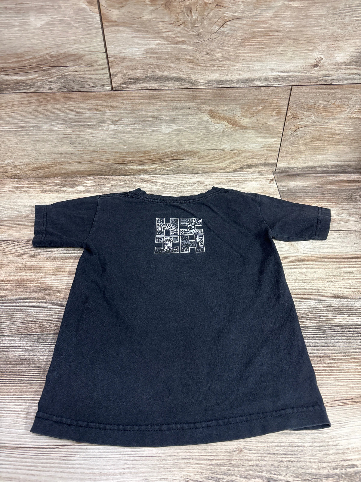 Back view of a black Hawaii's Finest short sleeve shirt for kids size 5/6T.