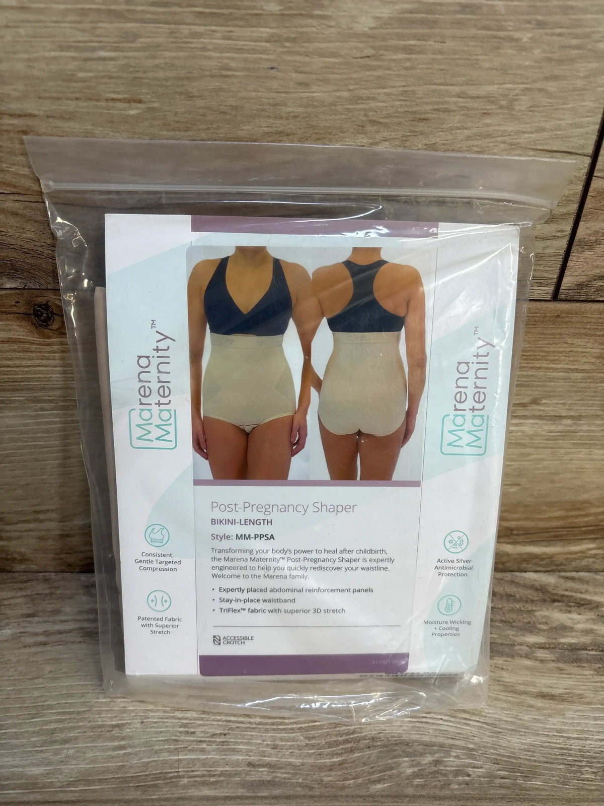 Front and back views of Marena Maternity bikini-length postpartum shaper, beige, showing abdominal support, in clear packaging
