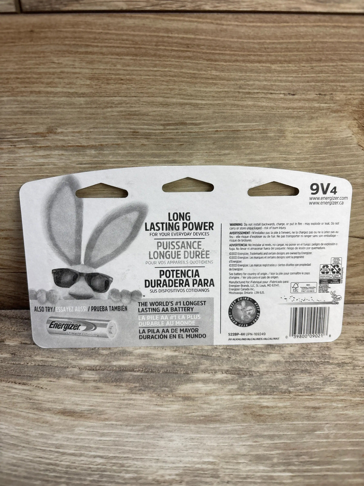 Back view of Energizer Max 9V 4-pack packaging showcasing “Long Lasting Power” headline and bunny graphic on a wood surface