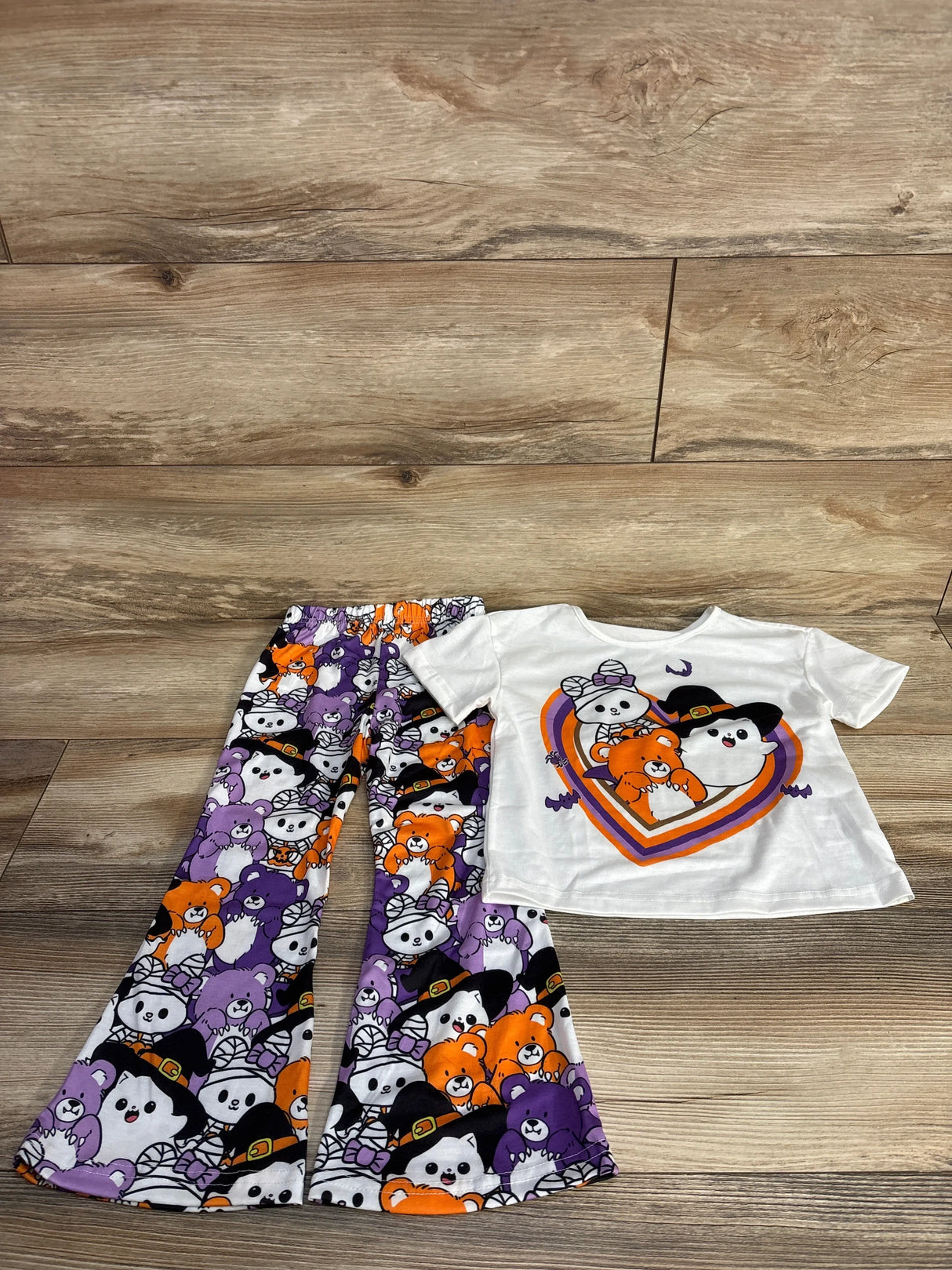 Halloween-themed kids outfit with cute bear print pants and matching white tee