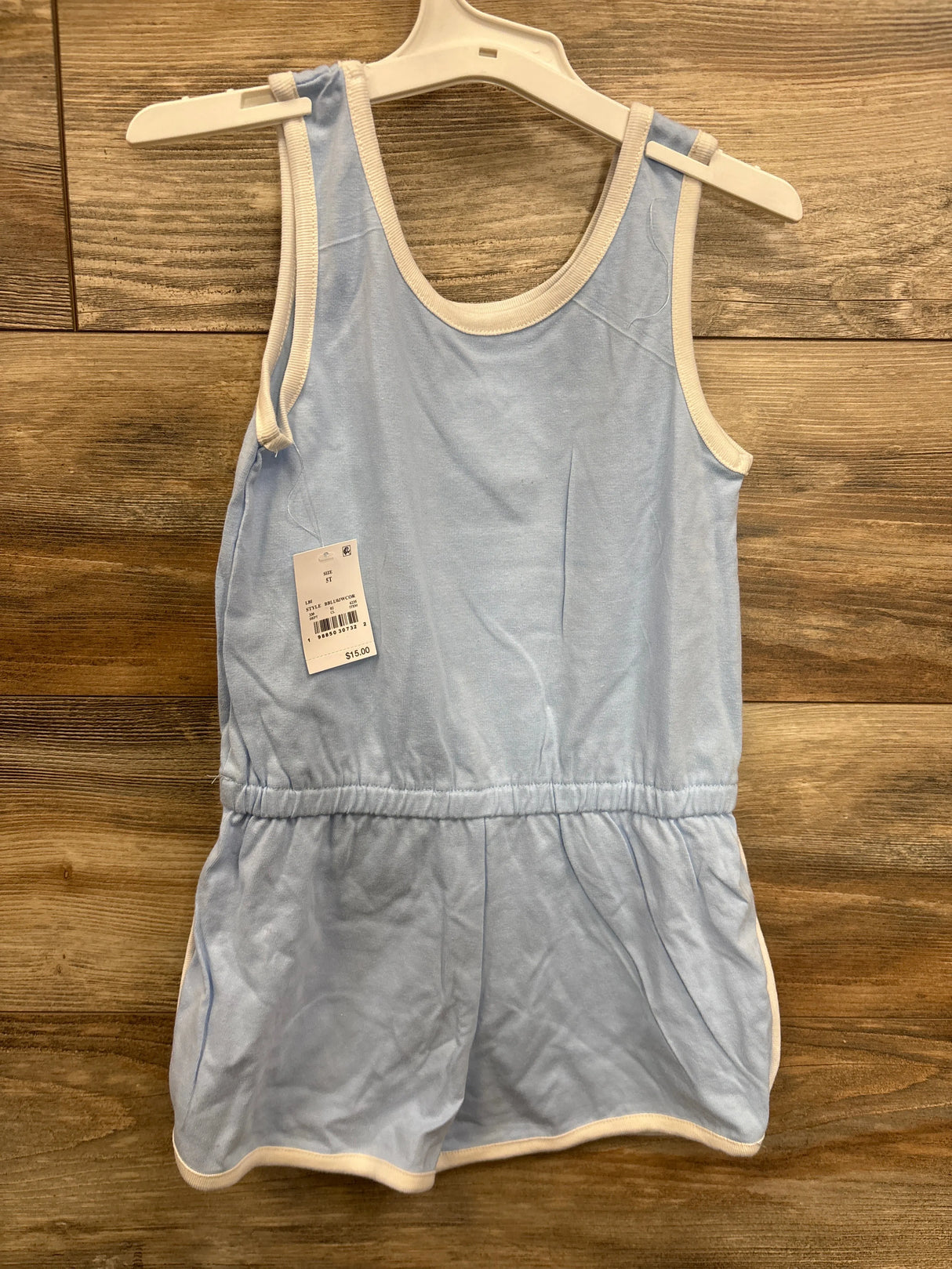 Light blue sleeveless toddler romper with white trim displayed on hanger