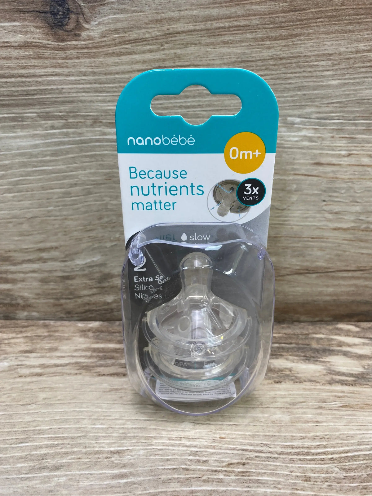 Front of Nanobébé slow-flow silicone nipples 2-pack in clear packaging showing ‘Because nutrients matter’ and 0m+ label