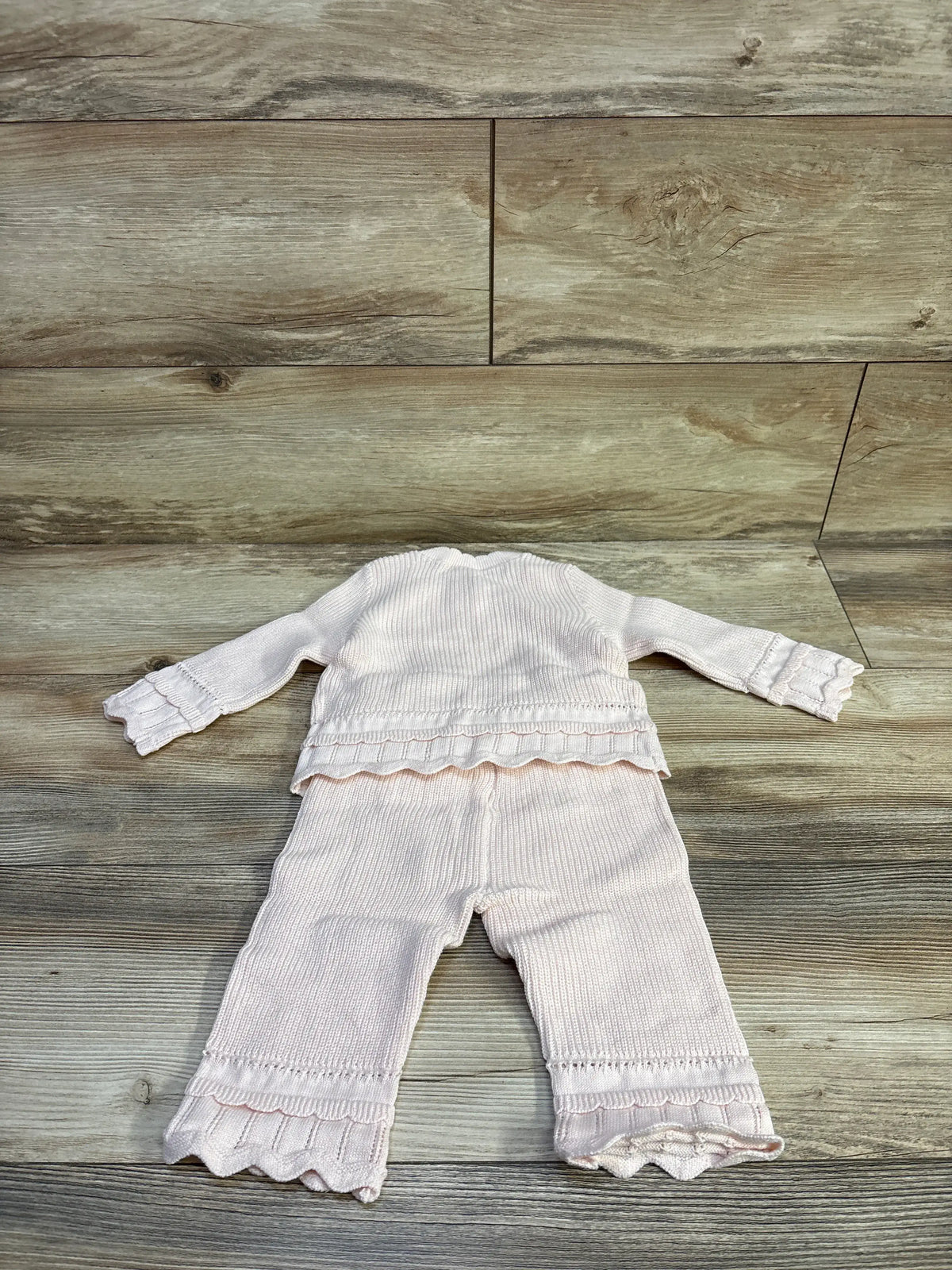 Baby Gap 2-piece pink crochet outfit set with cardigan and pants on a wooden background