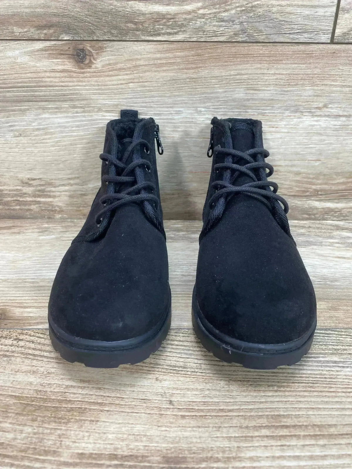 Front three-quarter view of Cat and Jack Ronin children’s black ankle boots showing lace-up detail and rubber tread on white background