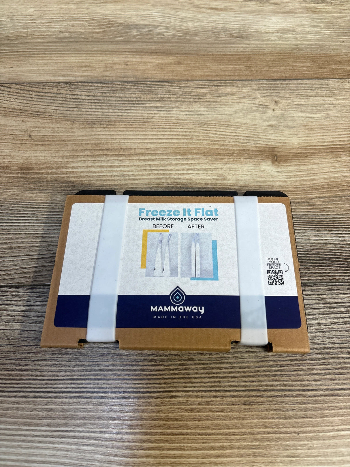 Freeze It Flat breast milk storage space saver box on wood surface