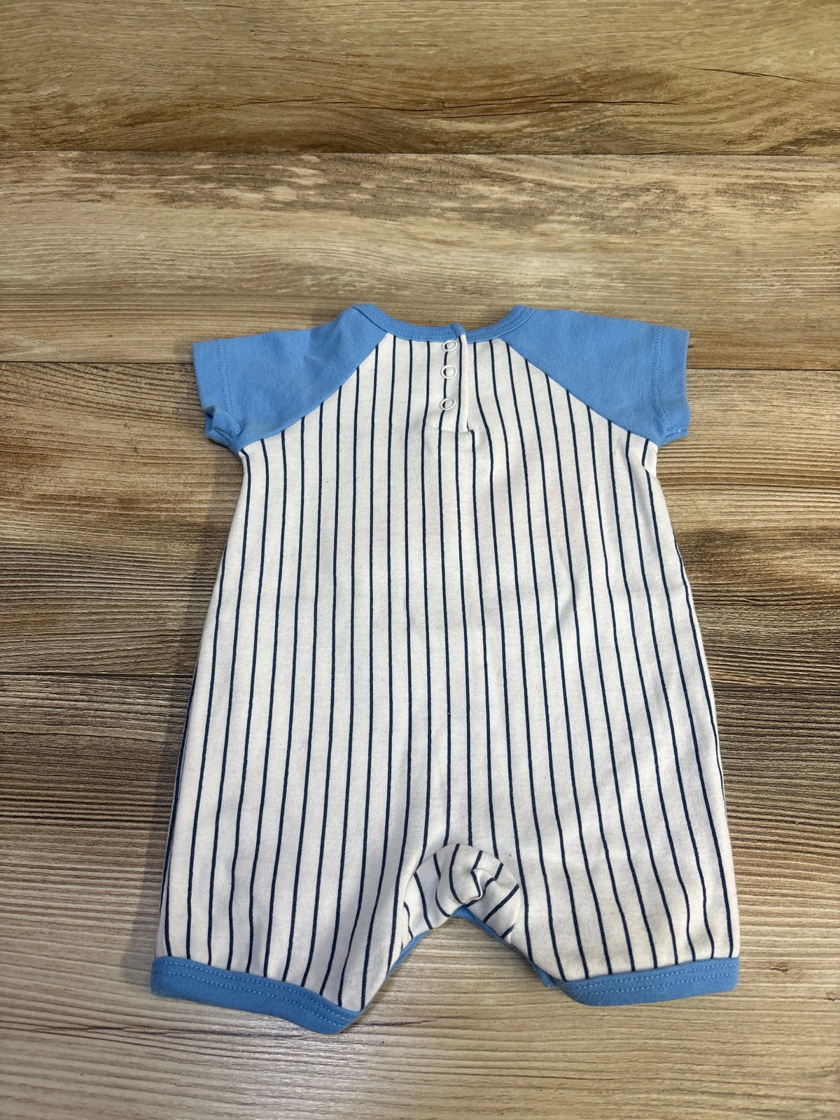 Front view of Little Beginnings Mommy’s All Star Shortie Romper, blue size 0 to 3 months, with striped body and snaps