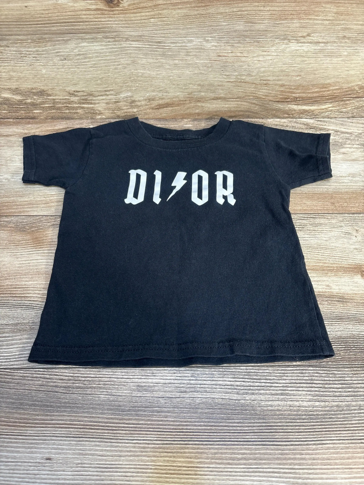 Black short sleeve toddler t-shirt with bold white logo and lightning bolt graphic