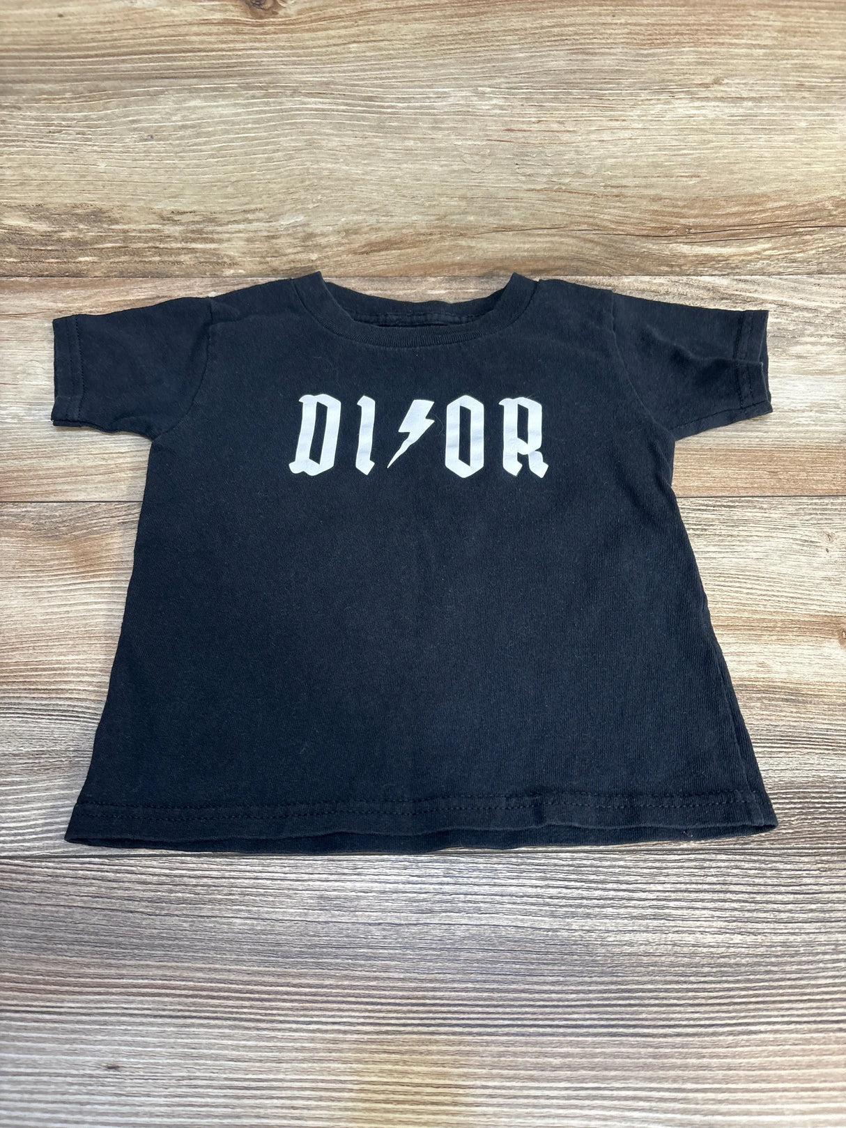 Black short sleeve toddler t-shirt with bold white logo and lightning bolt graphic