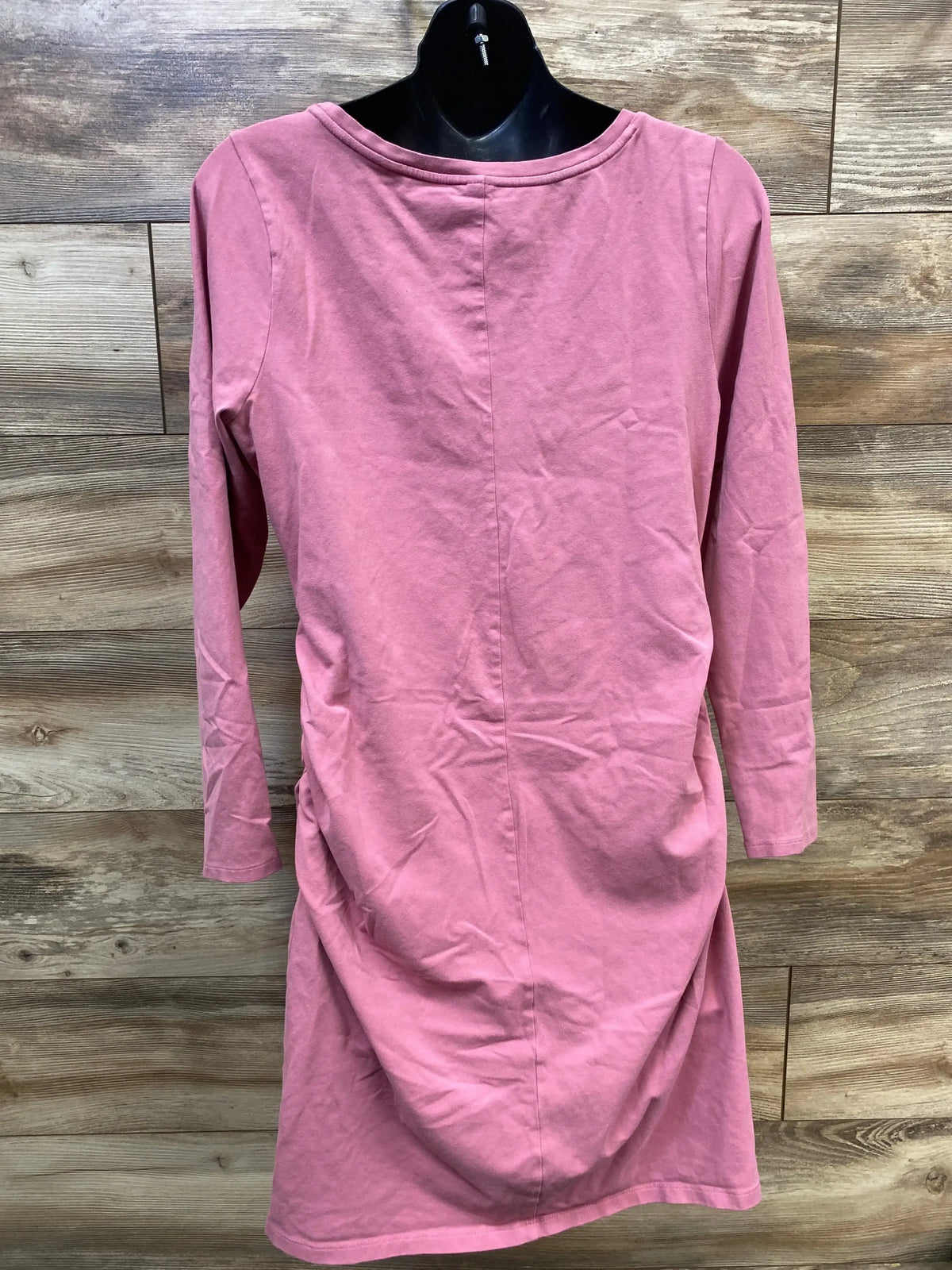 Back view of Old Navy maternity bodycon dress, pink XL, long sleeves, center-back seam and side ruching on wood plank background
