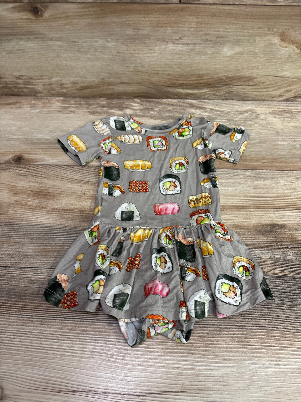 Front view of Posh P. bamboo sushi twirl skirt bodysuit dress in gray, showing short sleeves on wood-grain background
