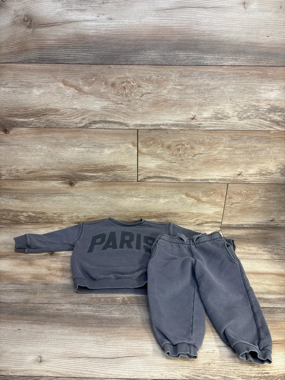 Gray kids Paris sweatshirt and jogger set on wood floor, cozy toddler outfit