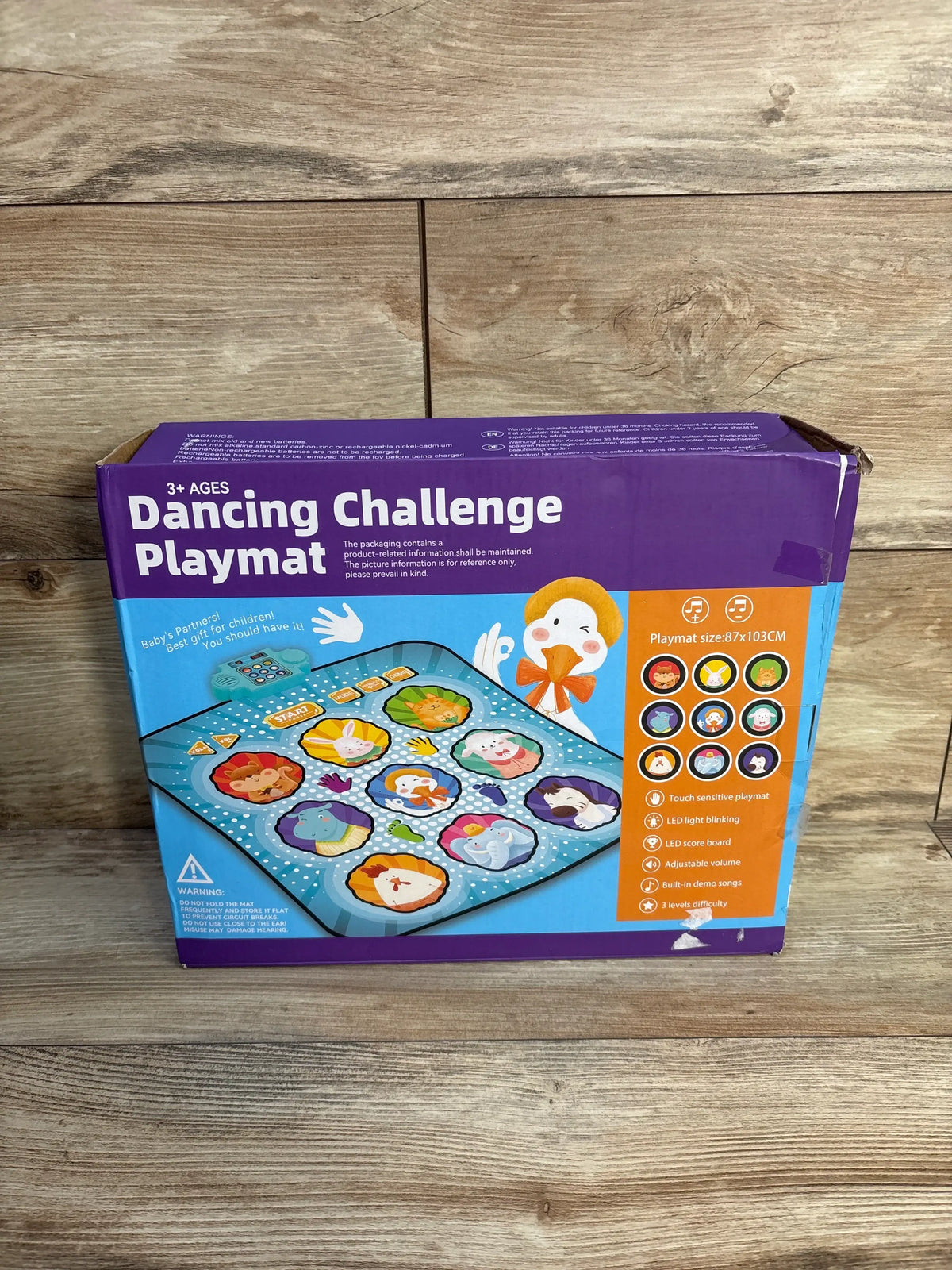 Front view of RenFox Dancing Challenge Playmat packaging showing touch sensitive mat, scoreboard, and three difficulty levels