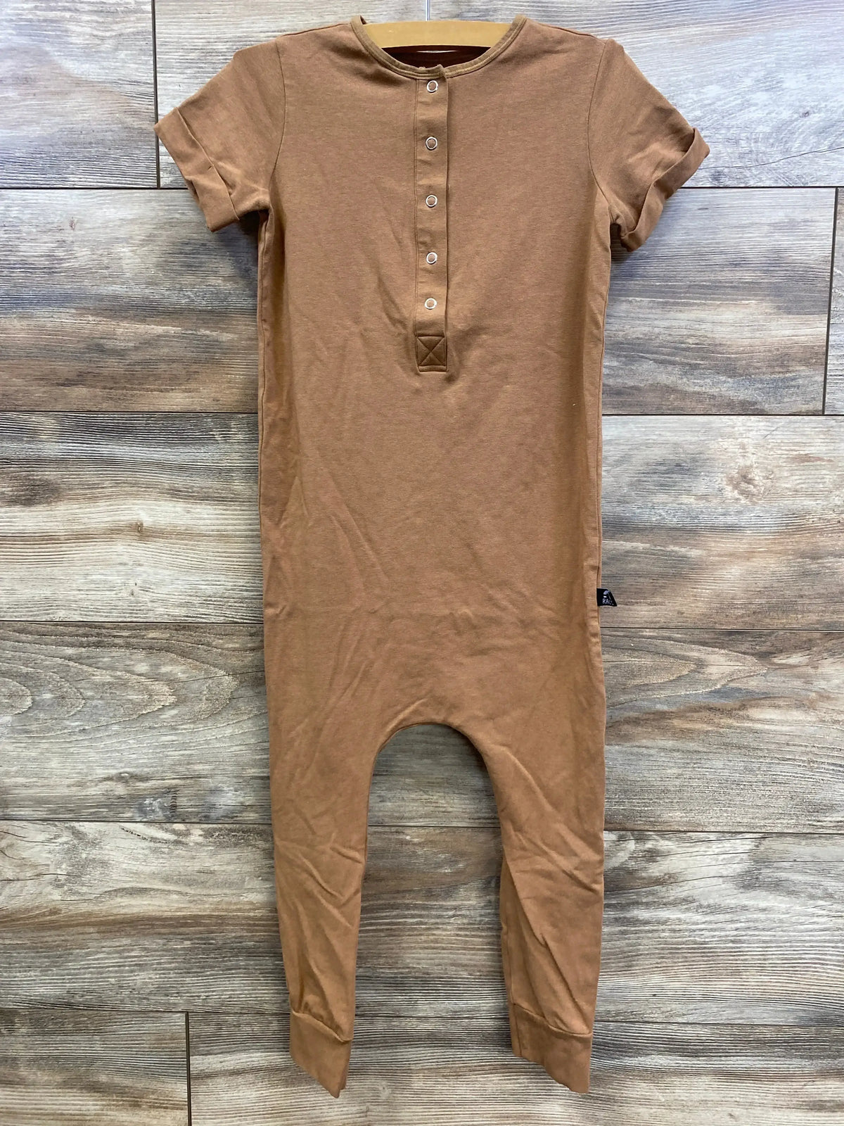 Front view of Rags Romper Browns sz 5/6 showcasing brown short sleeves, elastic neckline, and button placket