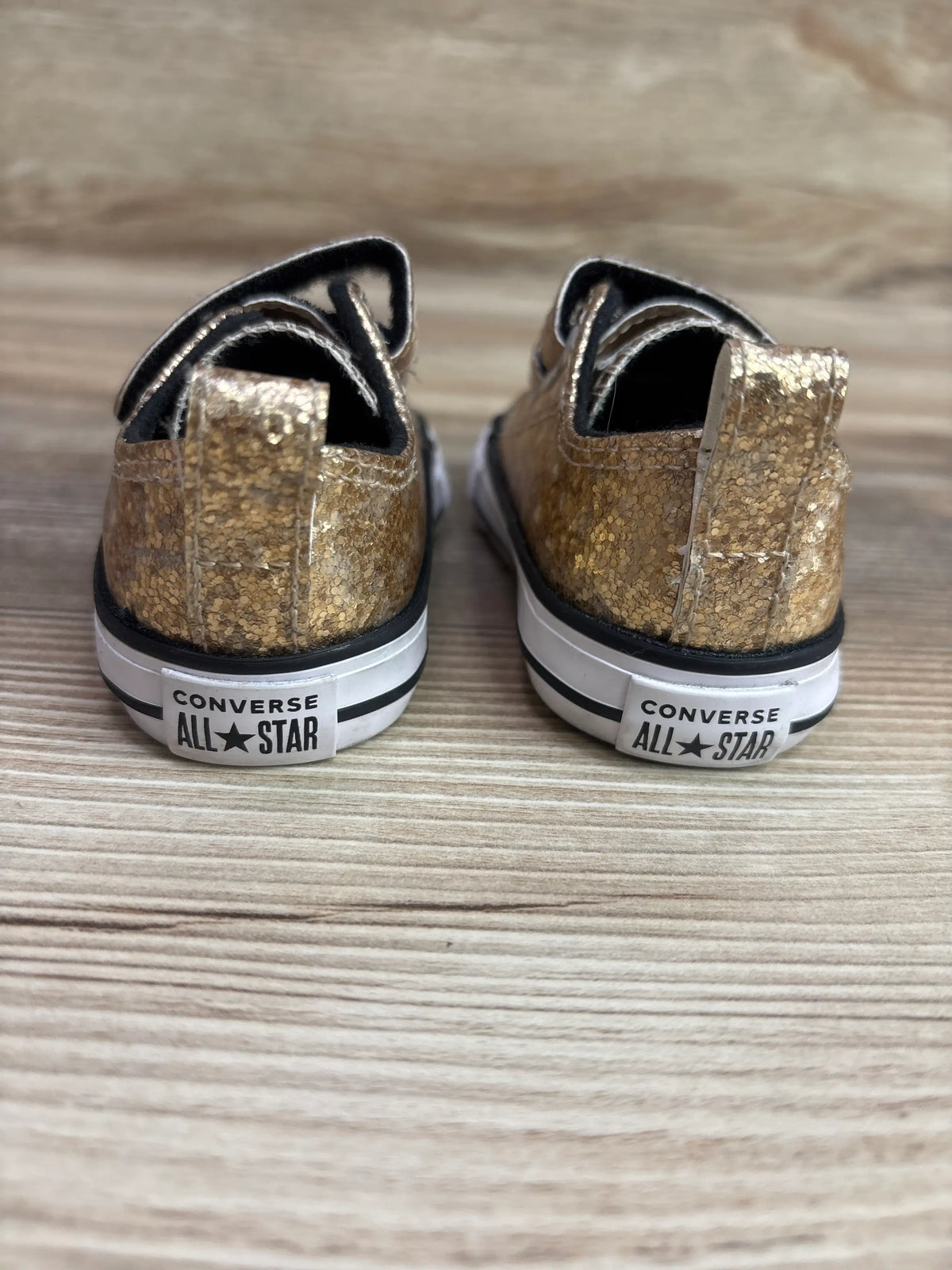 Rear view of Converse Chuck Taylor All Star Easy-On Double Velcro sneakers showcasing gold glitter uppers and branded heels