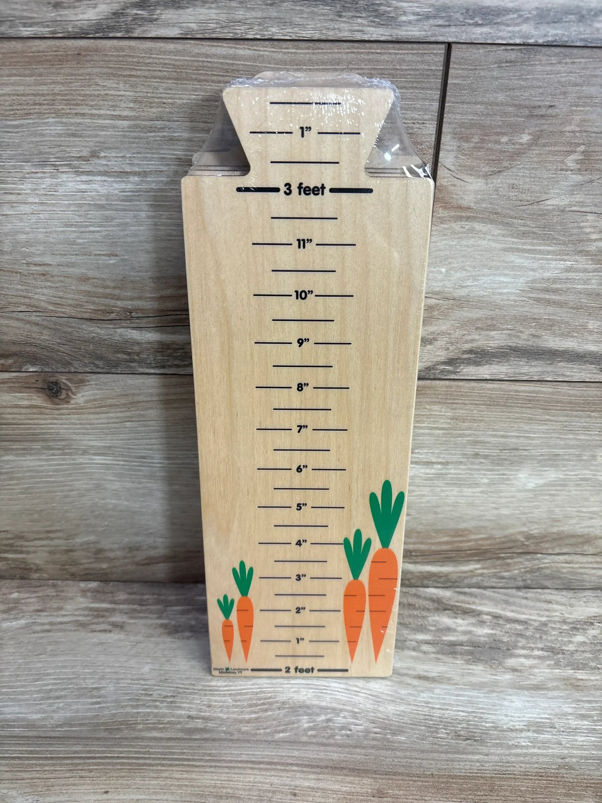 Wood growth chart ruler with carrot illustrations for kids, measures up to 3 feet.
