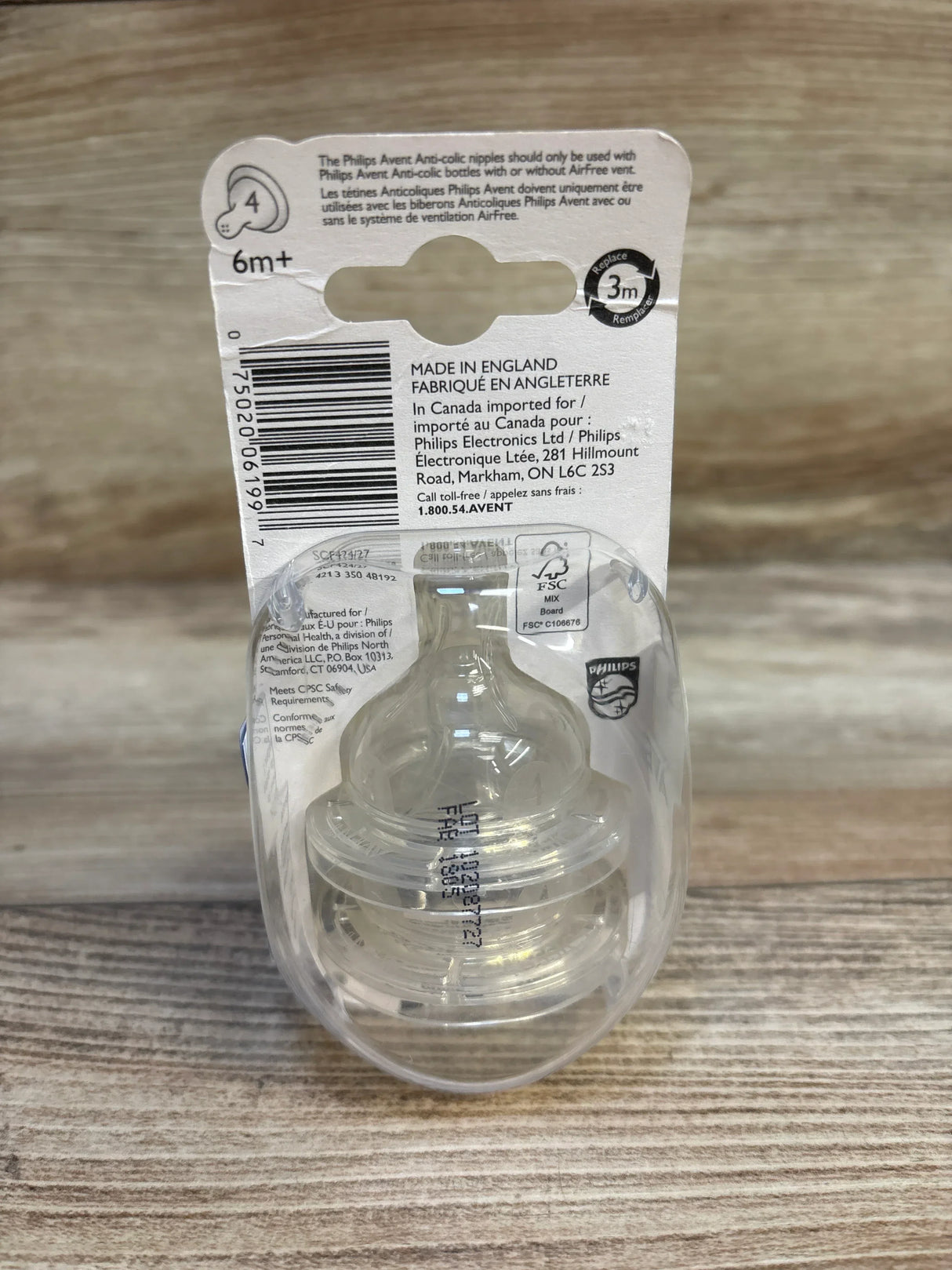 Front view of Philips Avent 2-pack anti-colic fast-flow nipples showing clear silicone design and 6m+ label on wood tabletop