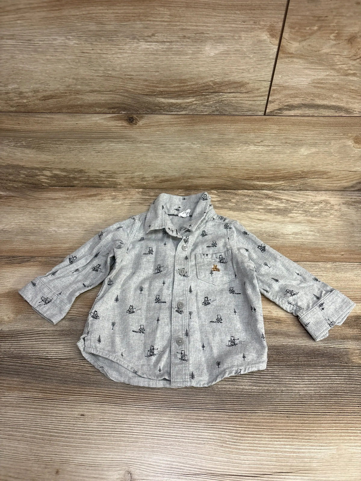 Light gray toddler button-up shirt with black bear and tree pattern, long sleeves, and chest pocket