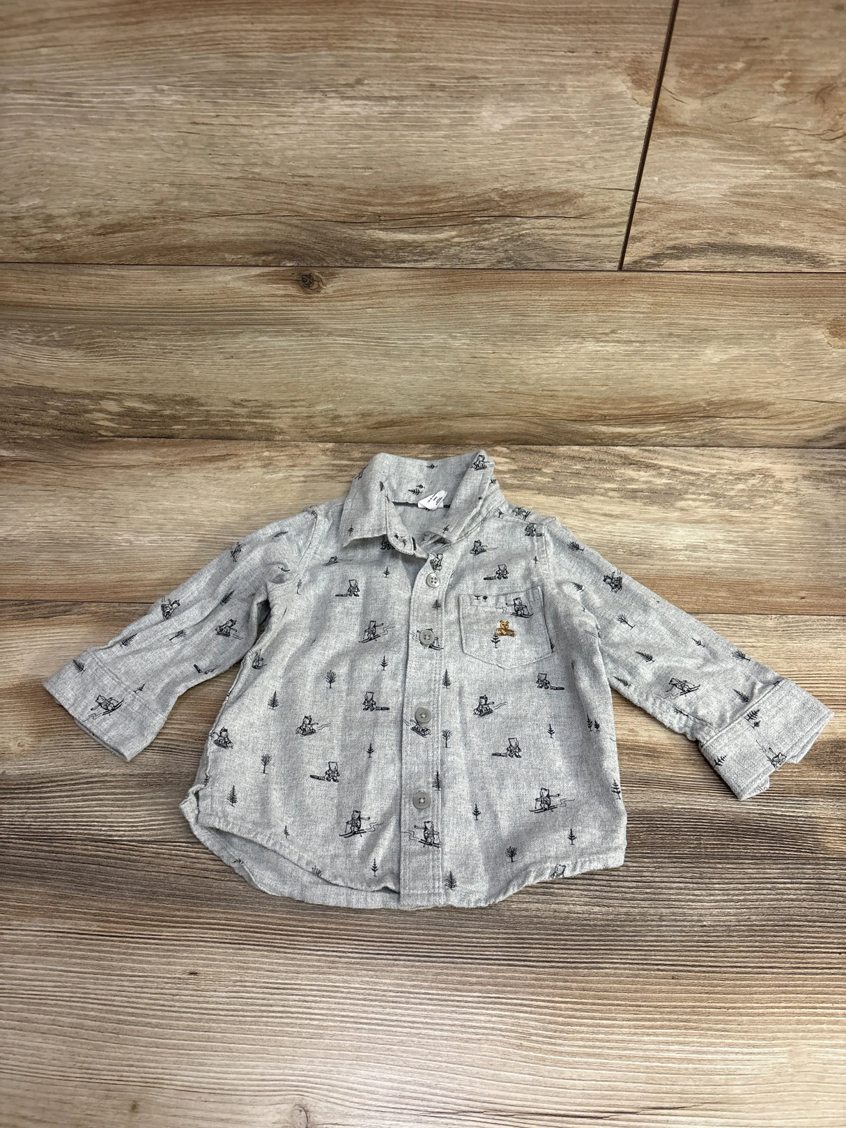 Light gray toddler button-up shirt with black bear and tree pattern, long sleeves, and chest pocket