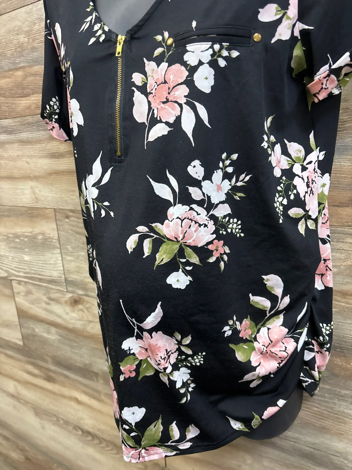 Sweet Wanderer black maternity v-neck top with pink and white floral print and gold zipper