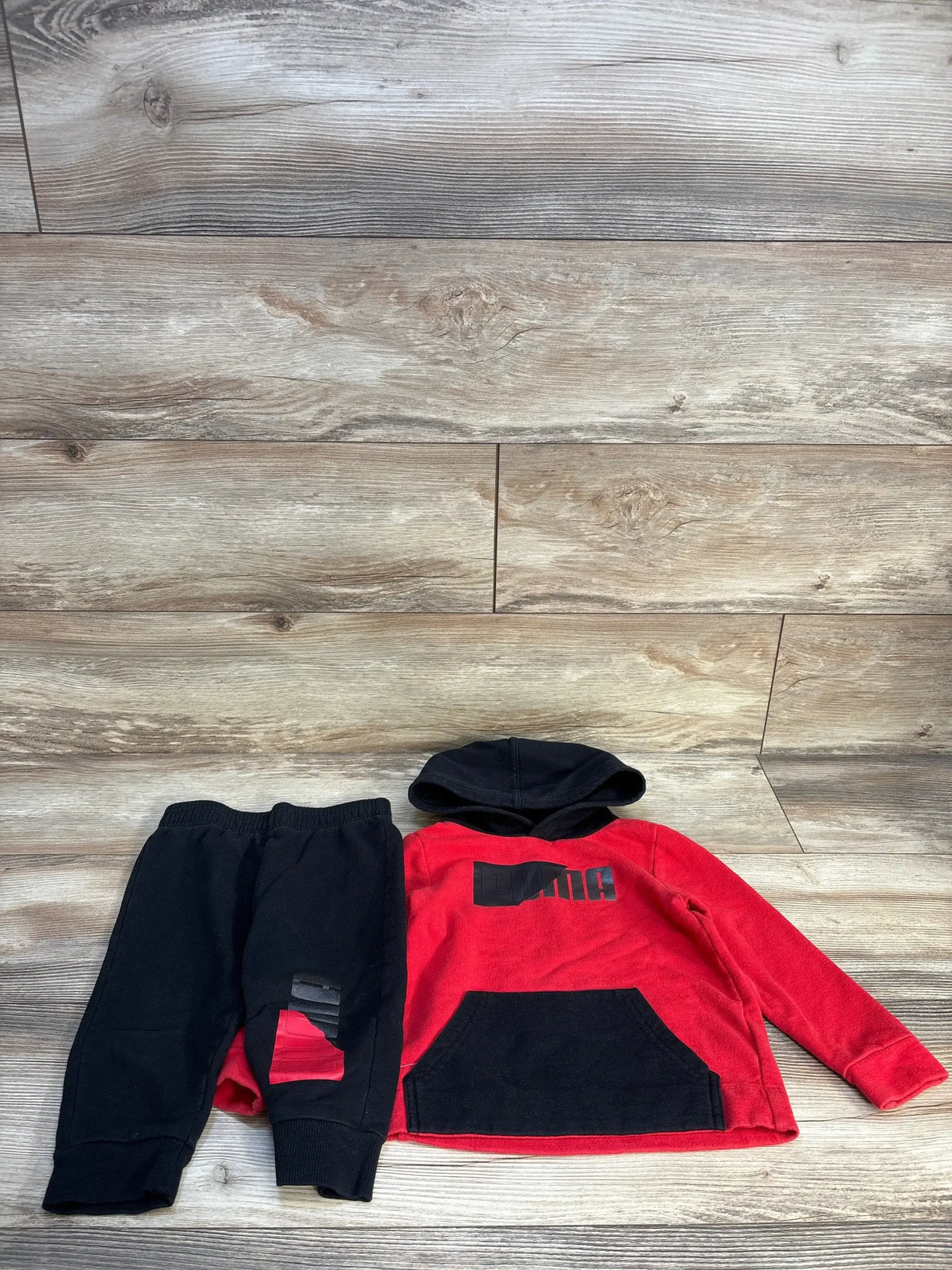 Red and black toddler hoodie and jogger pants set with graphic print, kids clothing flat lay