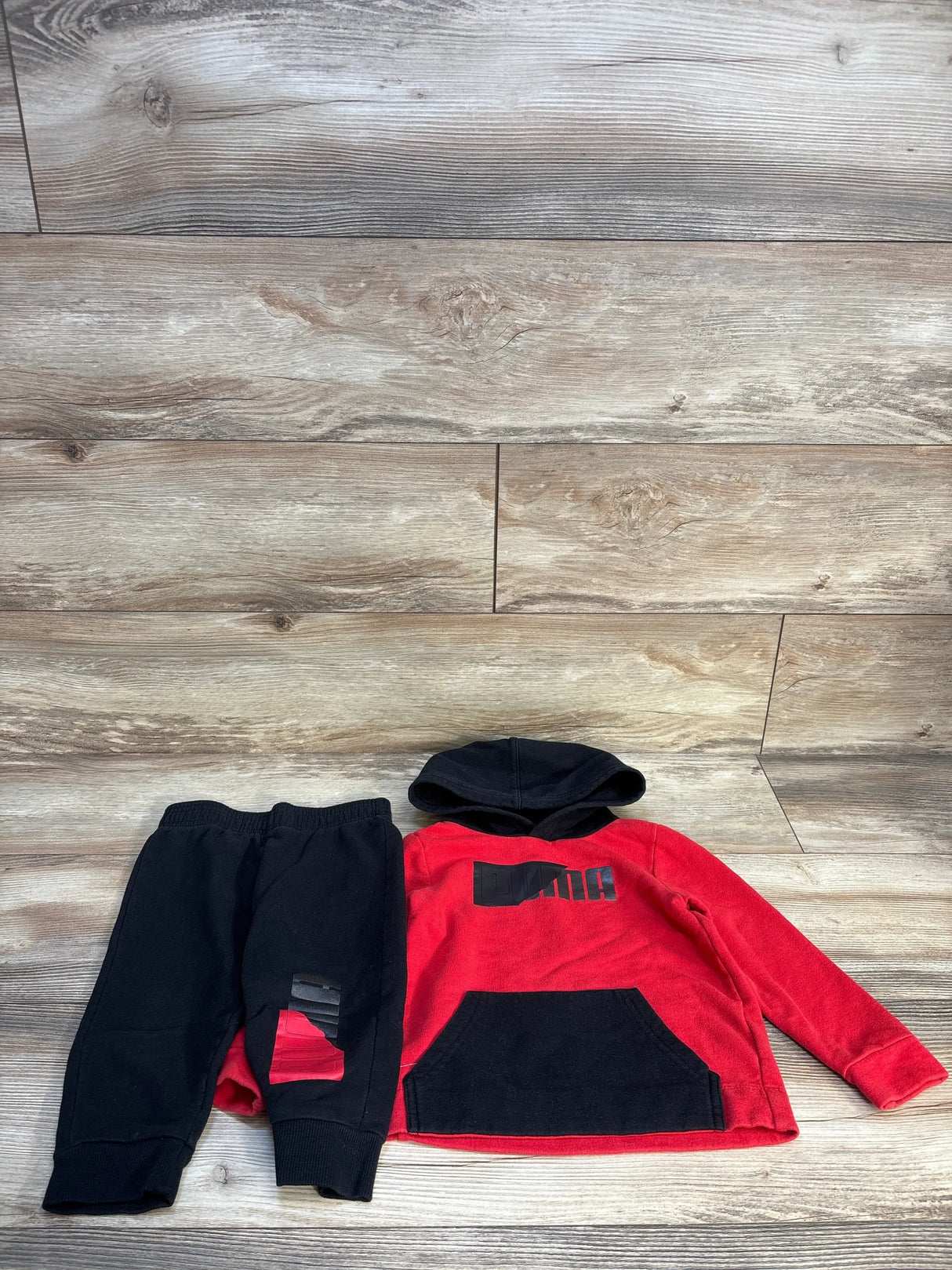 Red and black toddler hoodie and jogger pants set with graphic print, kids clothing flat lay