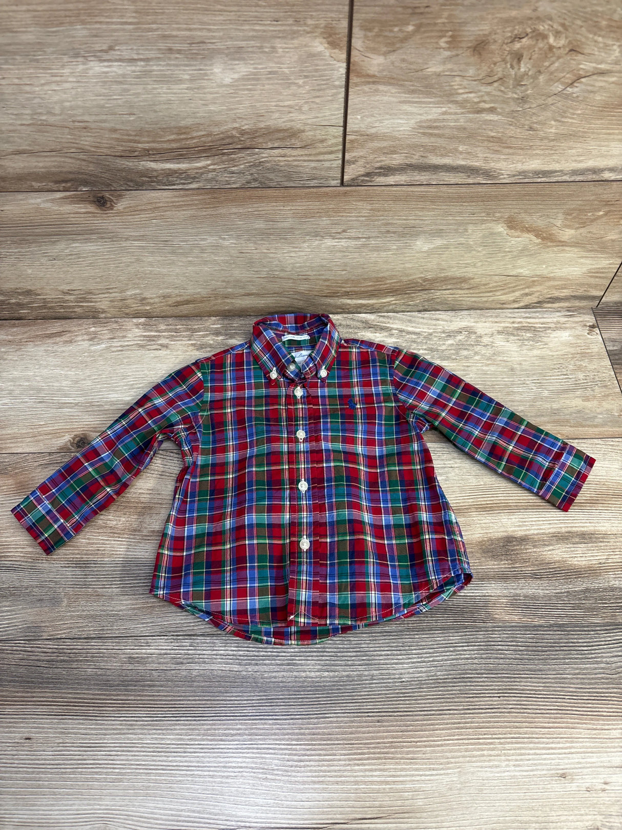 Red green blue plaid toddler button-down shirt on wood floor