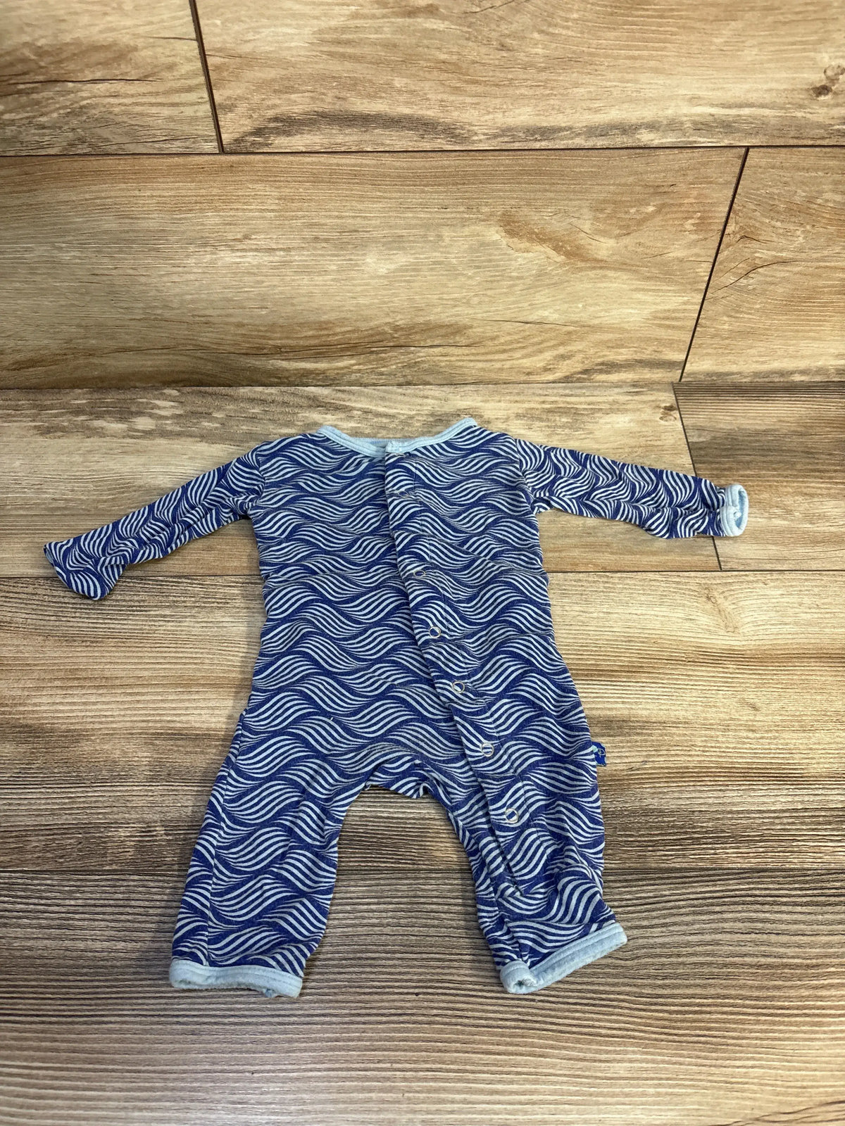 Front view of Kickee Pants Kite Water Lattice bamboo snap coverall showcasing blue lattice print and snap closures on a wood floor