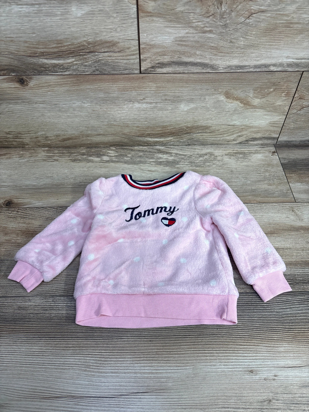 Pink fleece toddler sweatshirt with white polka dots and embroidered Tommy logo
