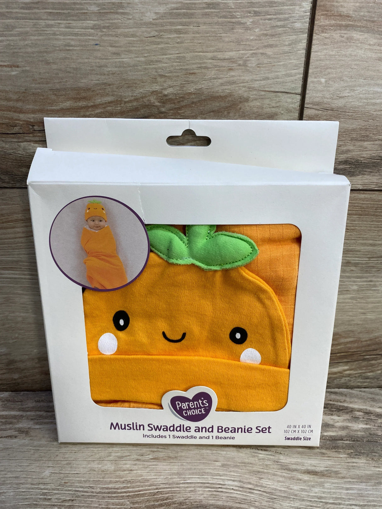 Parents Choice muslin swaddle and beanie set with orange smiling fruit design and green leaves
