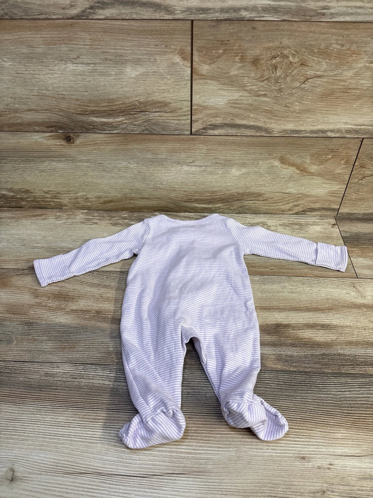 Front view of Just One You purple striped sleeper in size 3 months with long sleeves and attached footies on wood background
