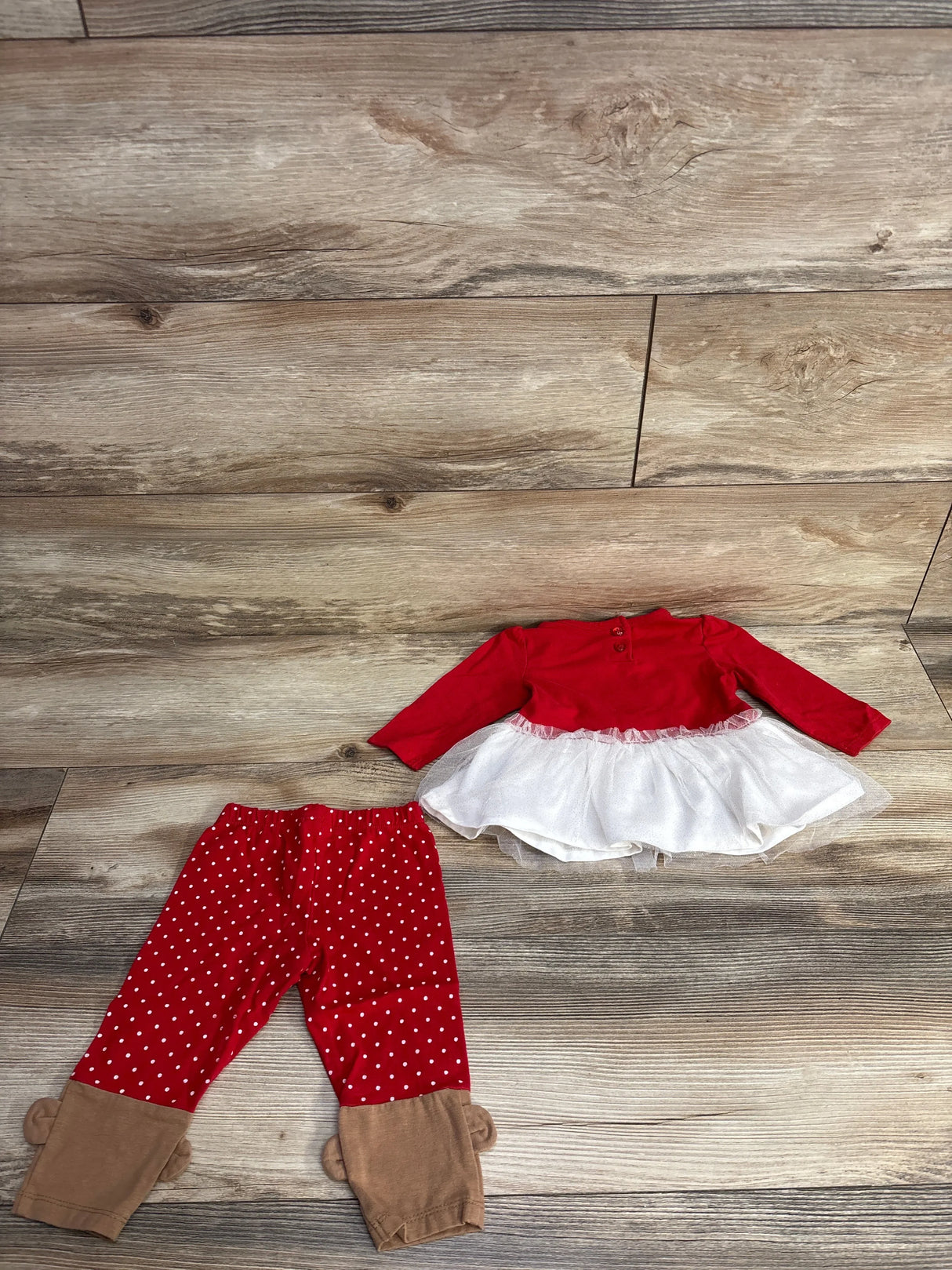 Red toddler dress with white tulle skirt and red polka dot leggings with tan cuffs