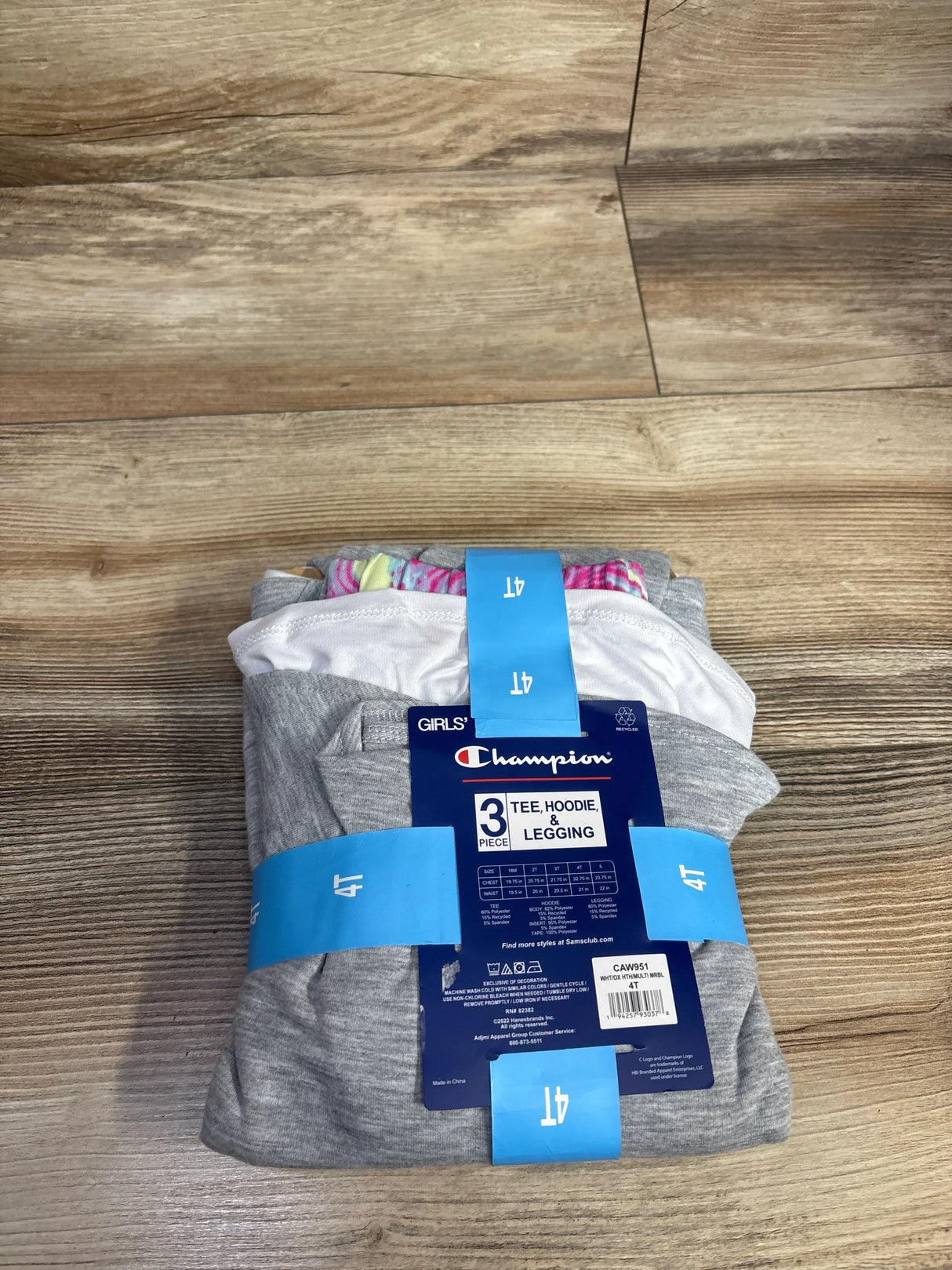 Girls' 3 piece set with tee, hoodie, and leggings size 4T on wood background