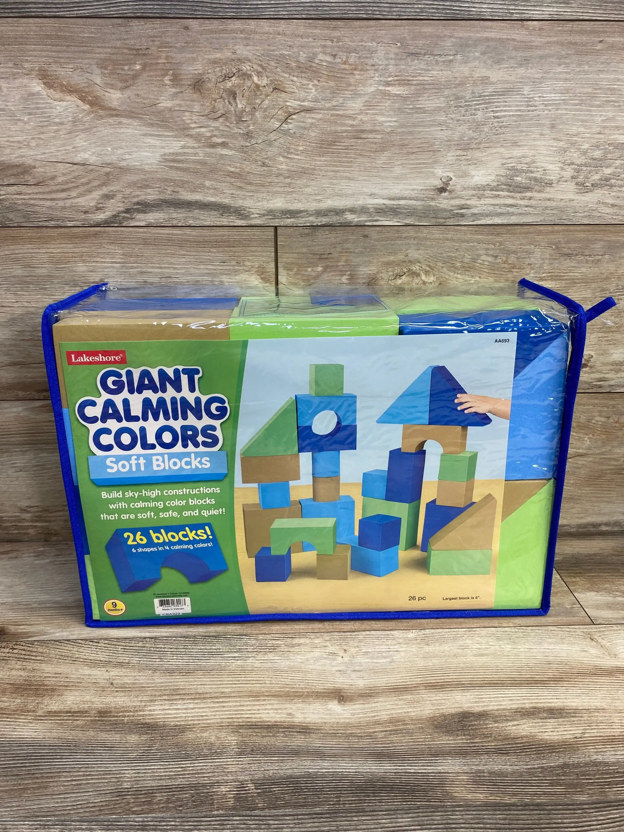 Front view of Lakeshore Giant Calming Colors soft blocks showcasing stacked blue and green foam shapes on wooden floor