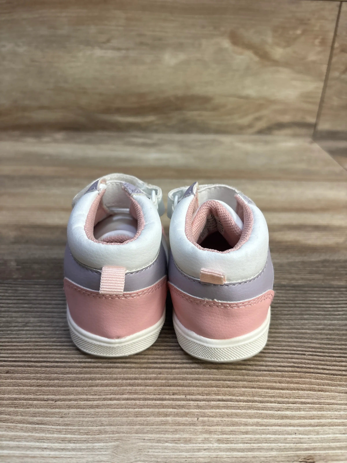 Rear view of Children’s Place First Steps colorblock high top sneakers in white and pink with gray accents, showing padded collars