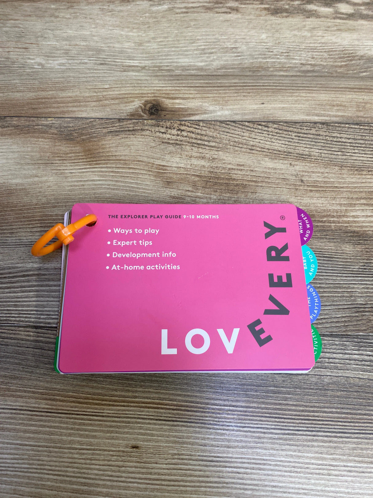 Pink LOVEVERY explorer play guide for 9-10 months with tips, activities, and development info