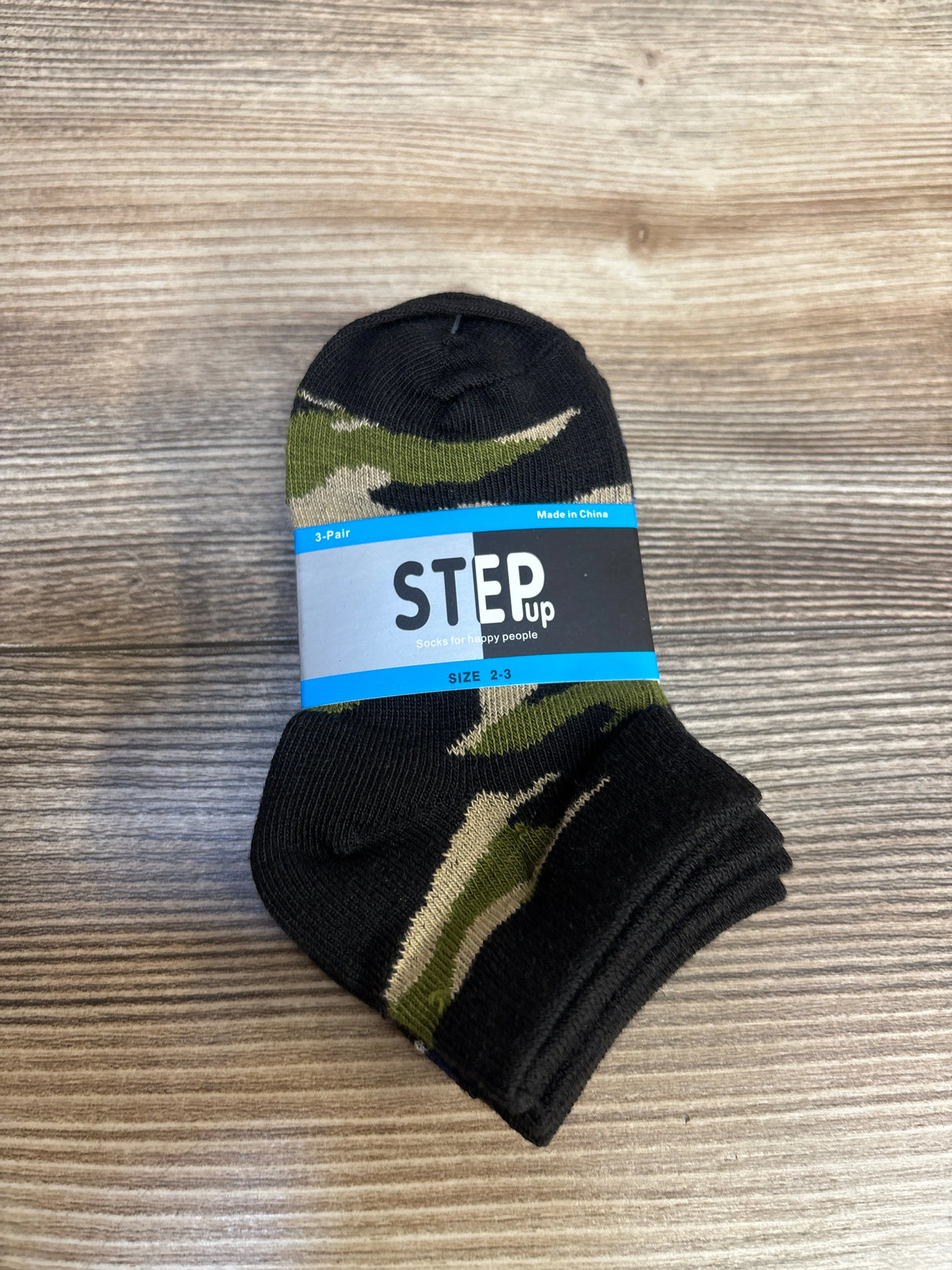 Toddler camo print socks size 2-3, Step Up brand, set of 3 on wood background