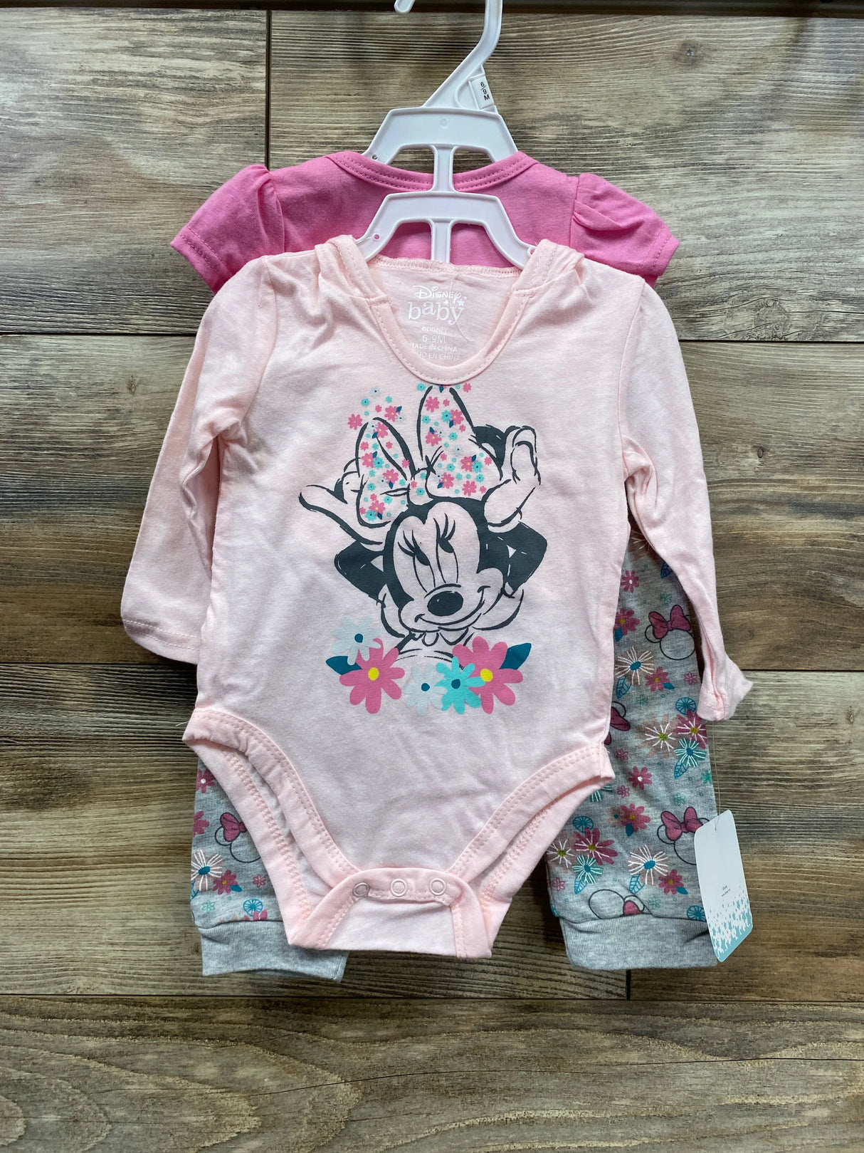 Baby girl pink Minnie Mouse onesie with matching floral pants and pink shirt set