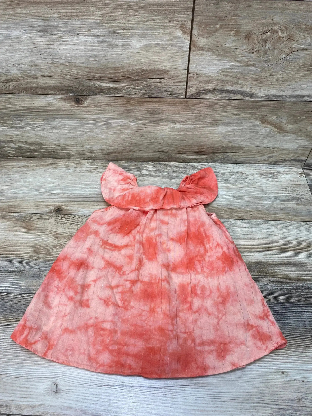 Flat-lay of Splendid pink tie-dye toddler dress (18-24 months) with ruffle collar and A-line skirt on wood background