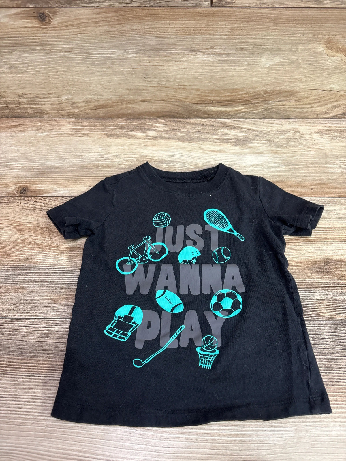 Black Carter's toddler t-shirt featuring 'Just Wanna Play' text and blue sports graphics