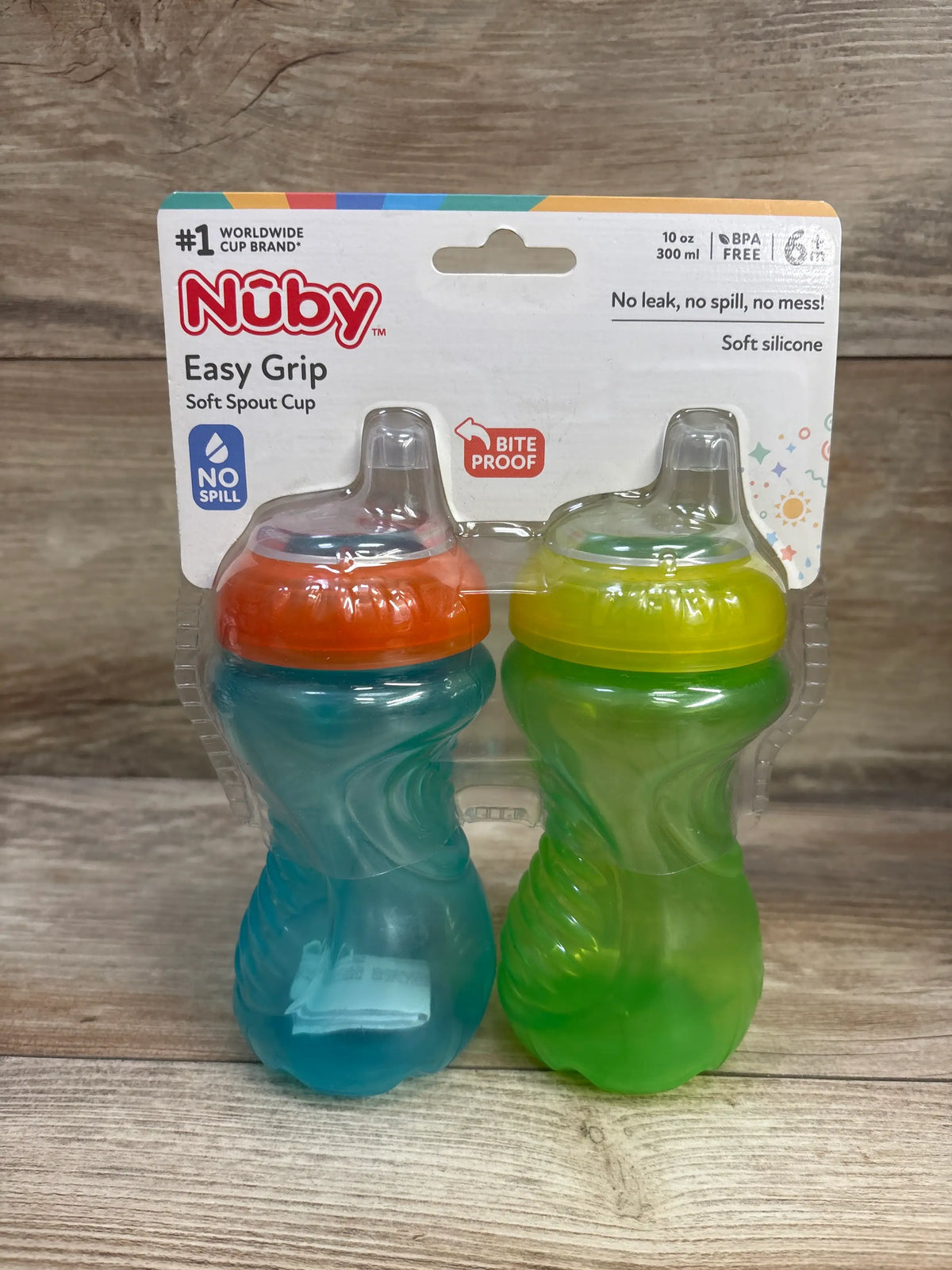 Front view of Nuby Easy Grip Soft Spout Cups 2pk in blue and green, 10 oz each, in retail packaging