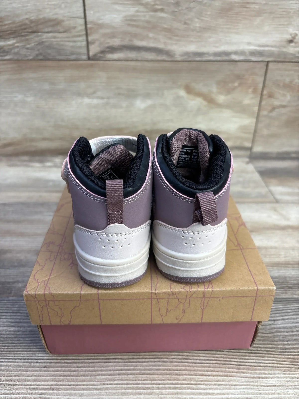 Rear view of Geers by Dream Seek mauve high-top toddler sneakers showing pull tabs and two-tone white sole on a pink kraft shoebox