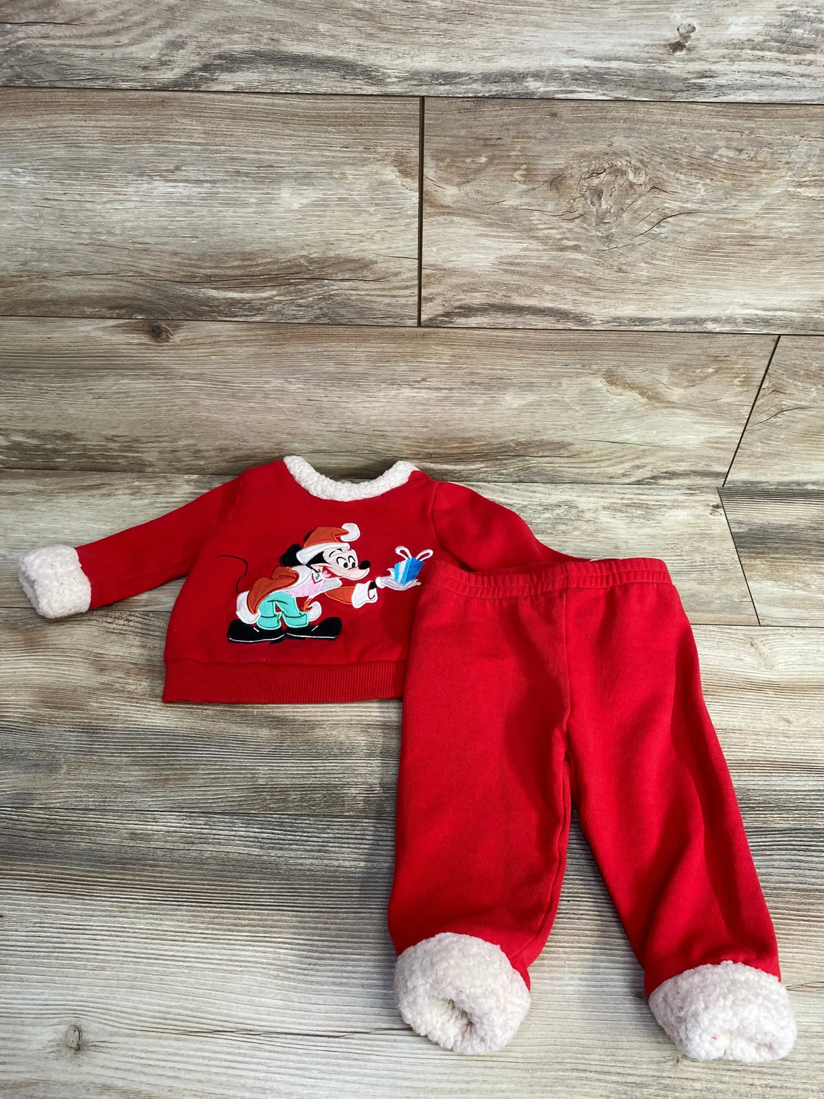 Red Mickey Mouse holiday pajama set with white trim, perfect for kids' Christmas sleepwear